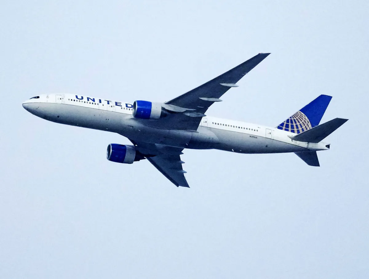 A United Airlines jetliner soars past an MLS soccer match in Commerce City, Colo., on July 8, 2023. (David Zalubowski/AP Photo)