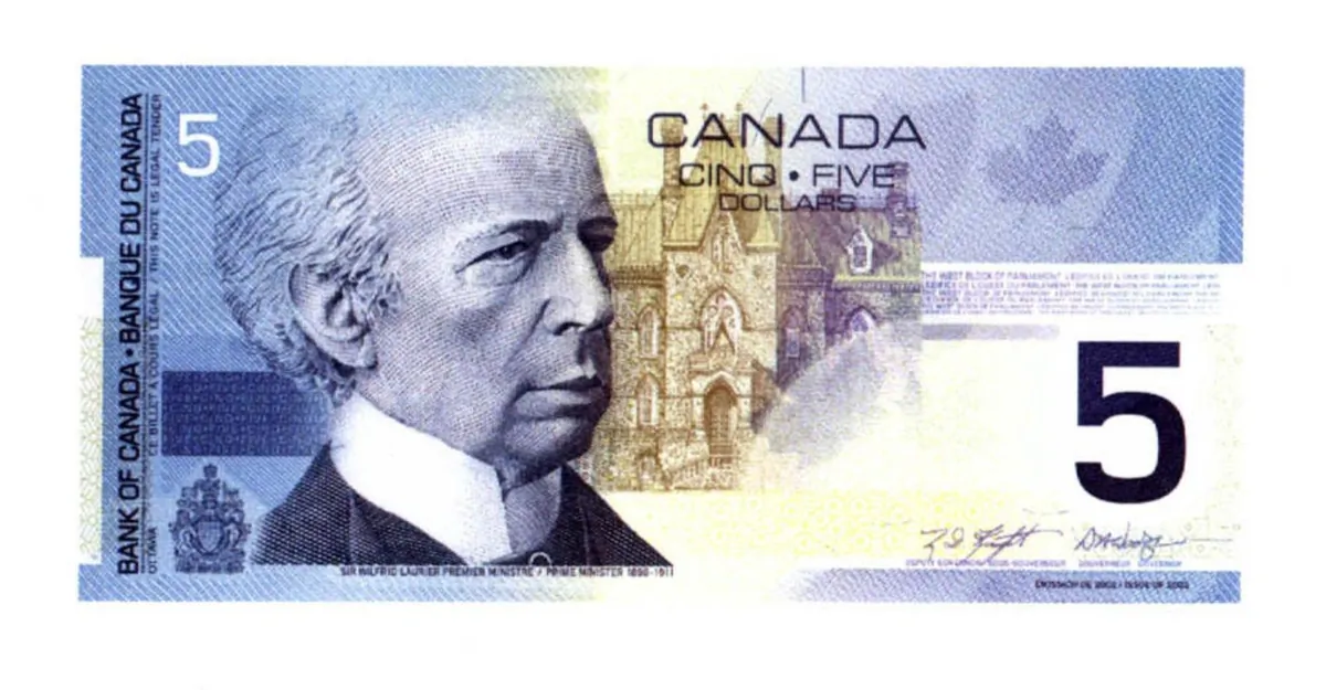 Image of Sir Wilfrid Laurier is shown on the Canadian $5 bill, in a file photo. (CP PHOTO/Paul Chiasson)