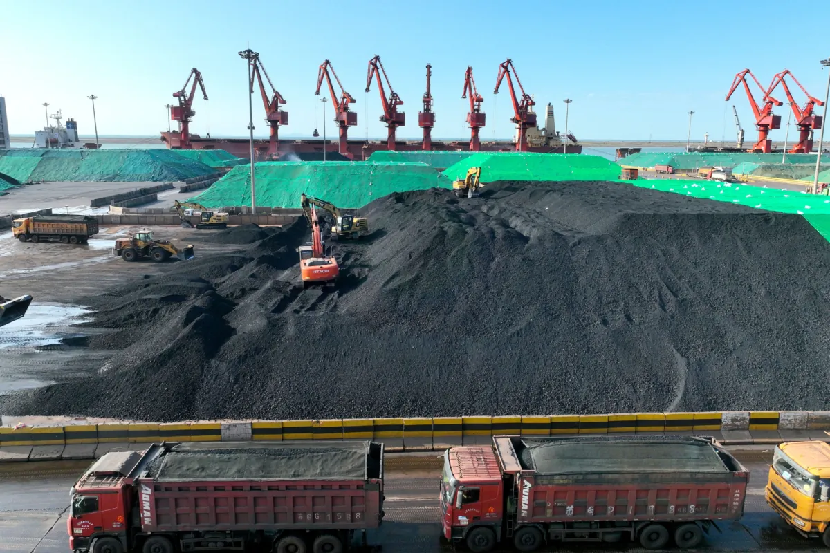 Trucks loaded with coal queueing at a port in Lianyungang, in China's eastern Jiangsu Province, on May 24, 2023. (STR/AFP via Getty Images)