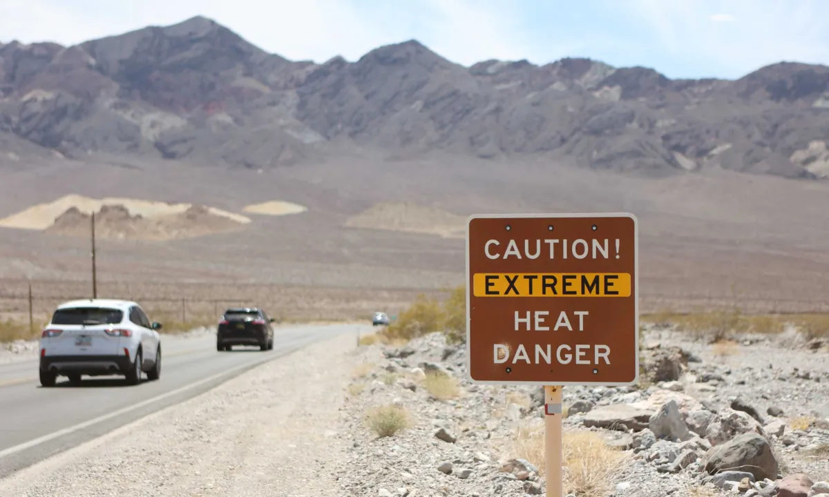 A heat advisory sign is shown along U.S. highway 190 during a heat wave in Death Valley National Park in Death Valley, California, on July 16, 2023. (Ronda Churchill/AFP via Getty Images)