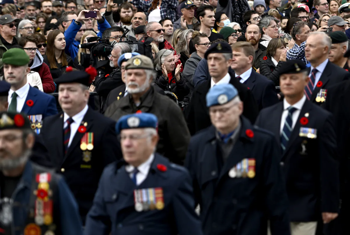 Veterans march for the National Remembrance Day Ceremony at the National War Memorial in Ottawa on Nov. 11, 2022. (The Canadian Press/Justin Tang)