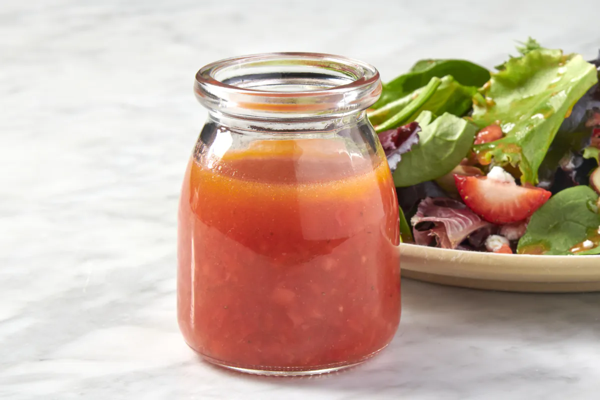 Fresh strawberries, a squeeze of lemon, Dijon mustard, and apple cider vinegar make for the dreamiest vinaigrette. (Alex Lepe/TNS)