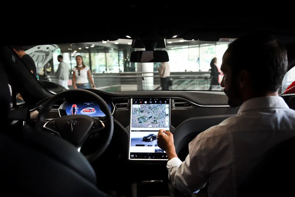 A seller shows the dashboard of the Tesla Model S car at the electric carmaker Tesla showroom of El Corte Ingles store in Lisbon, Portugal, on Sept. 1, 2017. (Patricia de Melo/AFP via Getty Images)