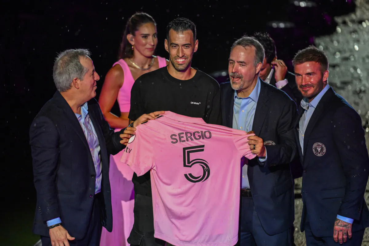Spanish midfielder Sergio Busquets (2nd L) is presented by (from R) owners of Inter Miami CF David Beckham, Jose R. Mas and Jorge Mas after signing a contract with Major League Soccer's Inter Miami CF, at DRV PNK Stadium in Fort Lauderdale, Fla., on July 16, 2023. (Giorgio Viera/AFP via Getty Images)