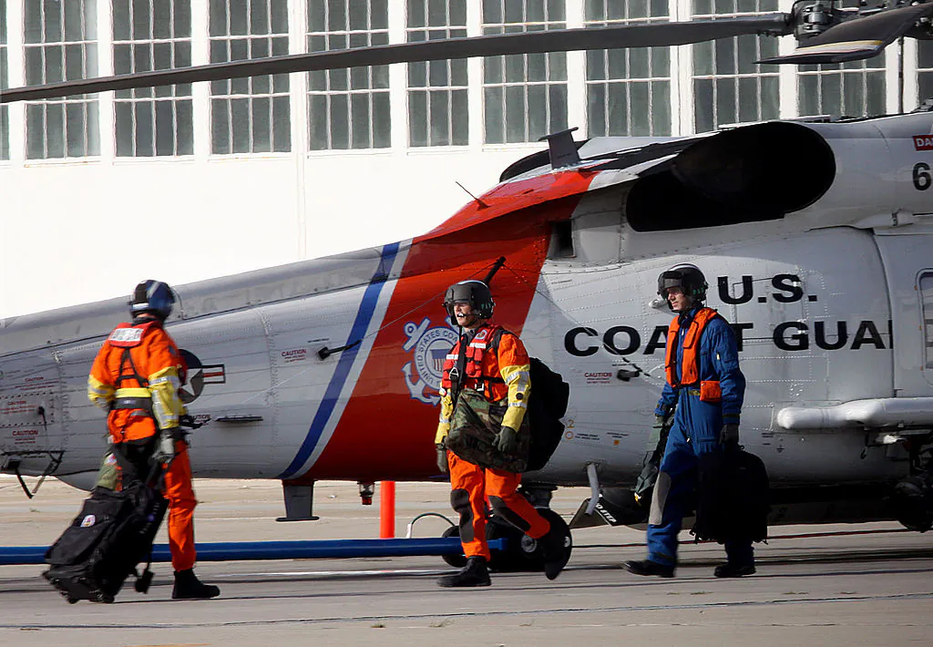 Coast Guard personnel depart on a search and rescue mission after a collision between a Marine Corps AH-1W Super Cobra helicopter and a Coast Guard C-130 plane which took place Thursday evening near San Clemente Island at the Coast Guard base in San Diego on Oct. 30, 2009. (Sandy Huffaker/Getty Images)