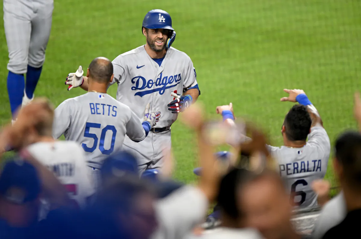 Chris Taylor (3) of the Los Angeles Dodgers celebrates with Mookie Betts (50) after hitting a grand slam in the sixth inning against the Baltimore Orioles at Oriole Park in Baltimore at Camden Yards on July 17, 2023. (Greg Fiume/Getty Images)