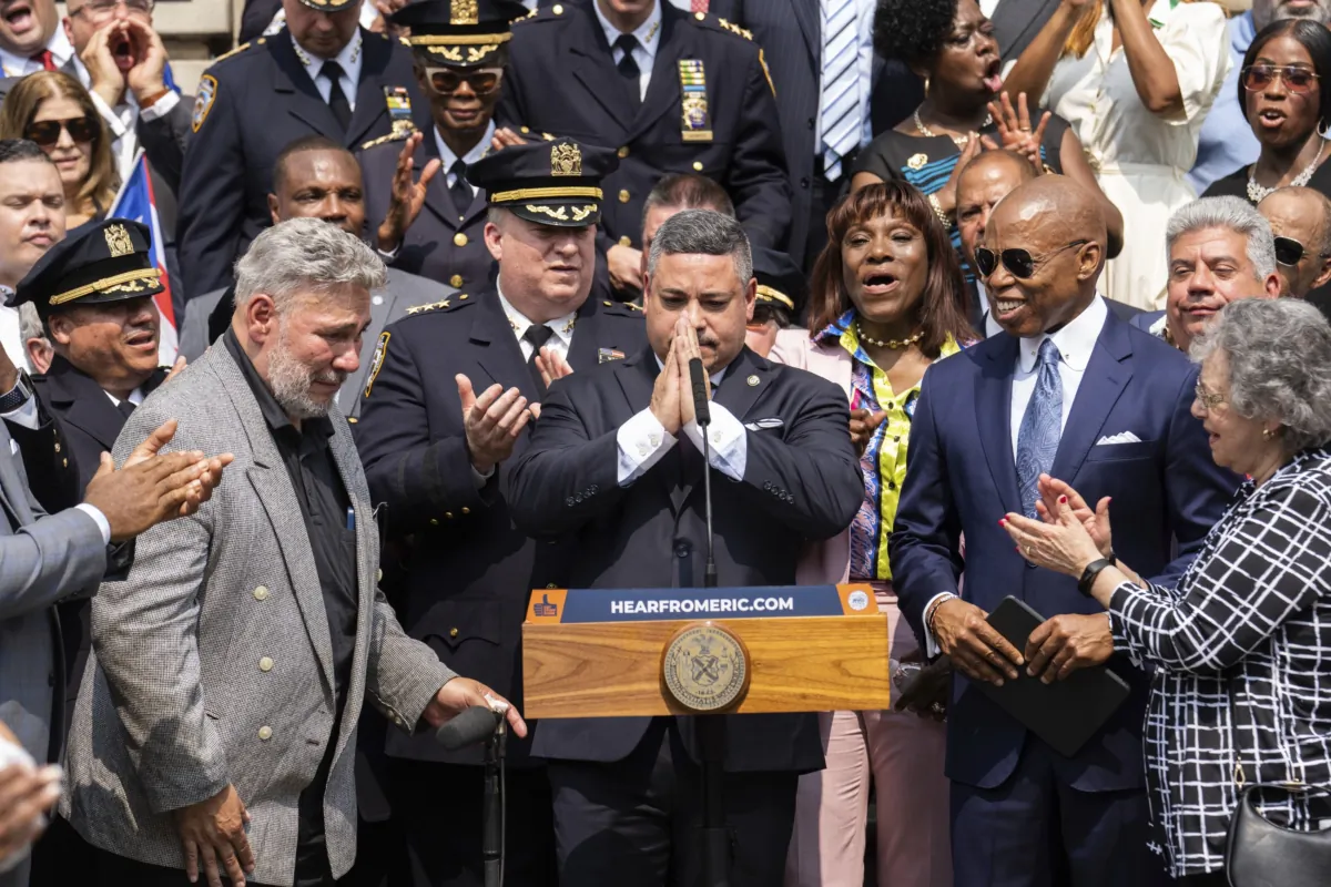Edward A. Caban gestures after being sworn in as NYPD police commissioner outside New York City Police Department 40th Precinct in New York on July 17, 2023. (Jeenah Moon/AP Photo)