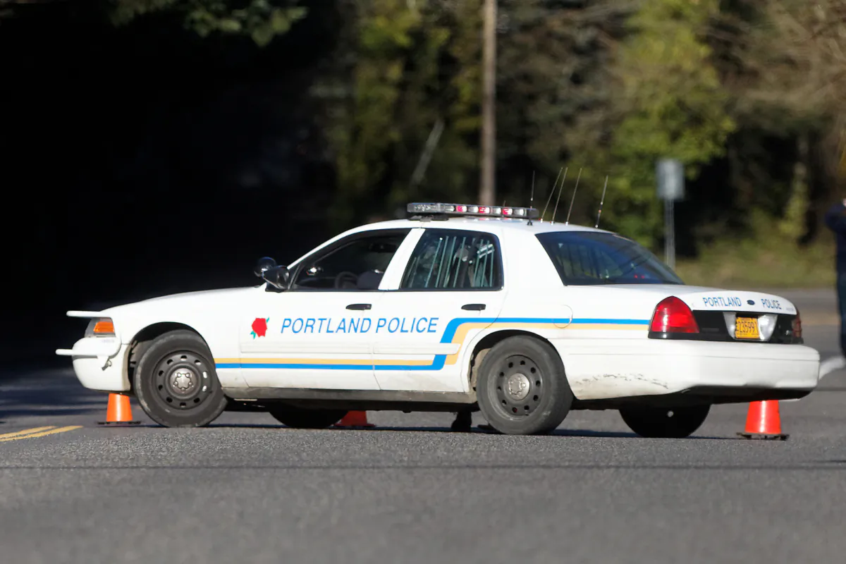 A Portland police vehicle is parked at a crime scene in Portland, Ore., on March 12, 2014. (Mike Zacchino/The Oregonian via AP)