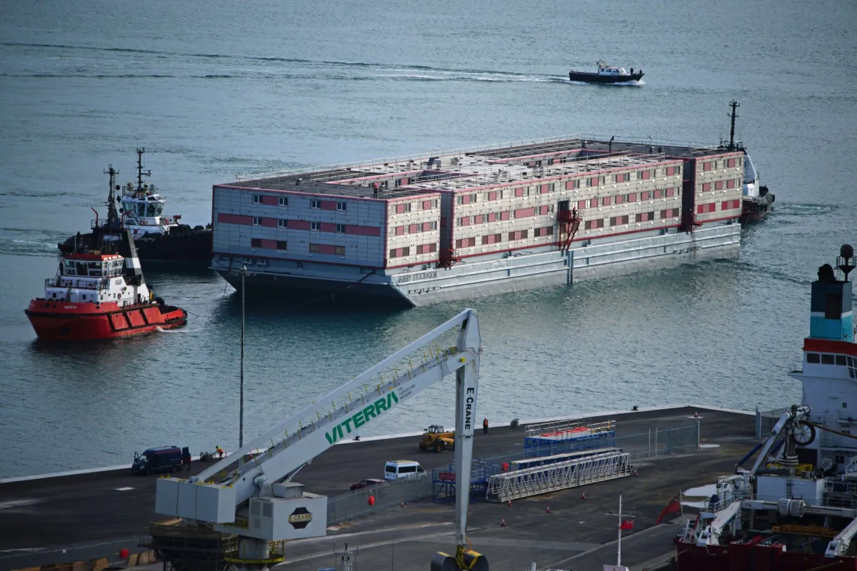 Tug boat Mercia pulls the Bibby Stockholm accommodation barge into Portland in Dorset, on July 18, 2023. (Ben Birchall/PA Media)