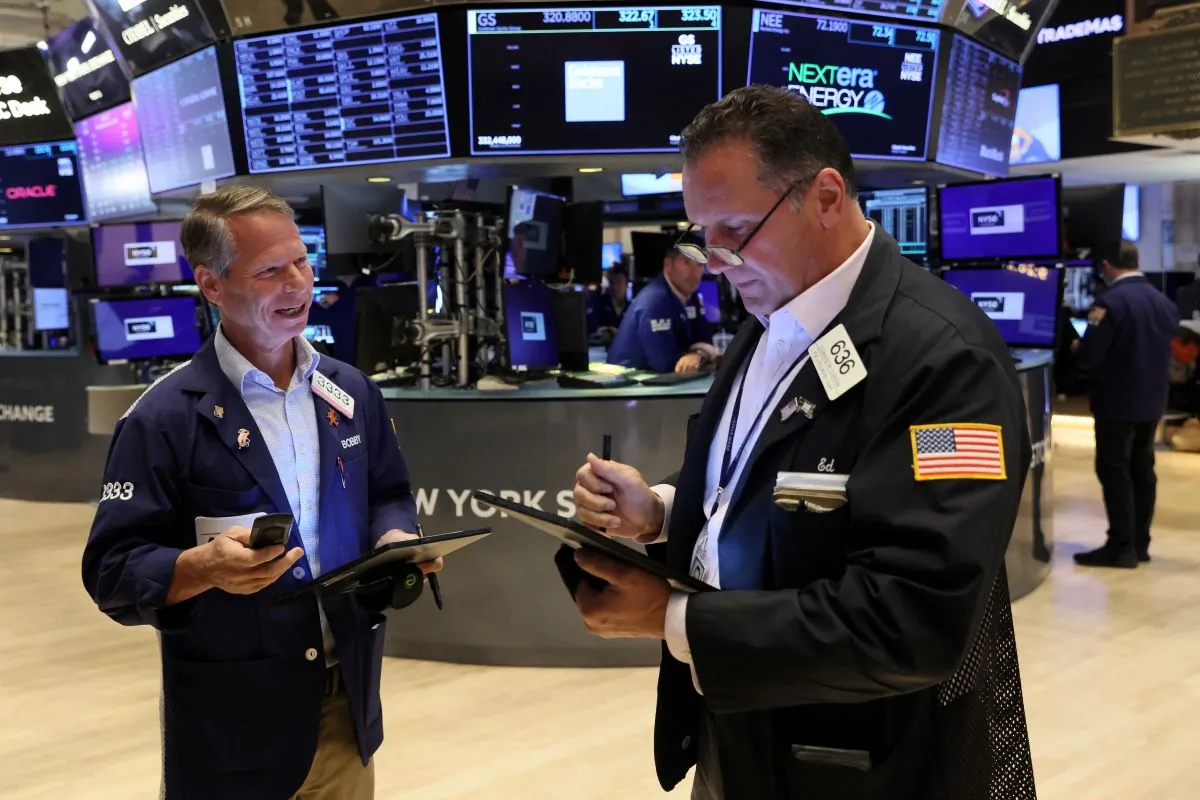 Traders work on the floor of the New York Stock Exchange (NYSE) in New York City on July 12, 2023. (Brendan McDermid/Reuters)