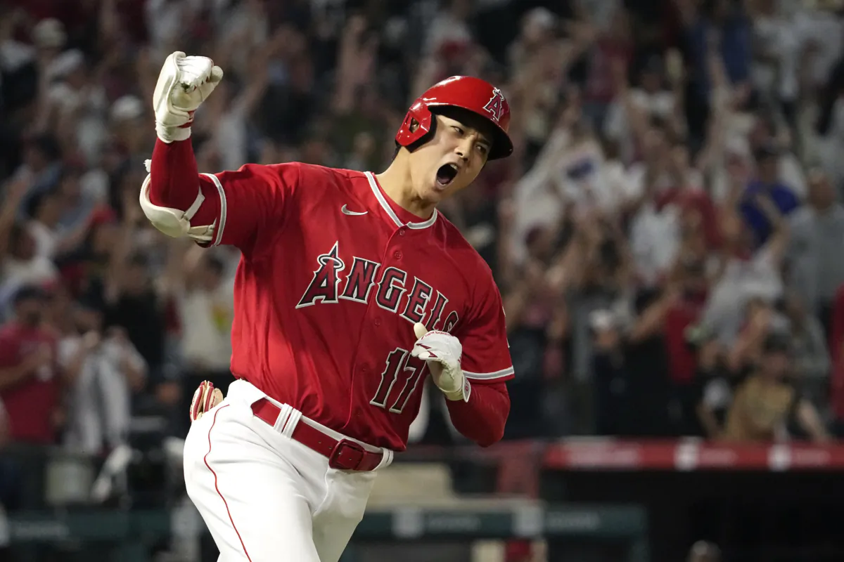 Los Angeles Angels' Shohei Ohtani celebrates as he rounds first after hitting a two-run home run during the seventh inning of a baseball game against the New York Yankees Monday, July 17, 2023, in Anaheim, Calif. (AP Photo/Mark J. Terrill)