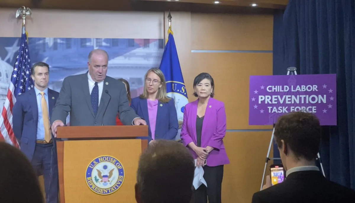 Rep. Dan Kildee (D-Mich.), flanked by Democrats, speaks during the launch of the Child Labor Prevention Task Force on July 18. (Joseph Lord/Epoch Times)