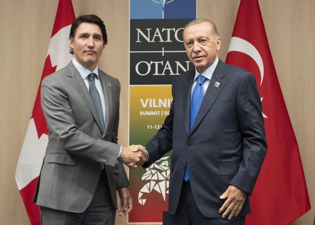Prime Minister Justin Trudeau shakes hands with Turkish President Recep Tayyip Erdogan at the NATO Summit, July 11, 2023 in Vilnius, Lithuania. (The Canadian Press/Adrian Wyld)