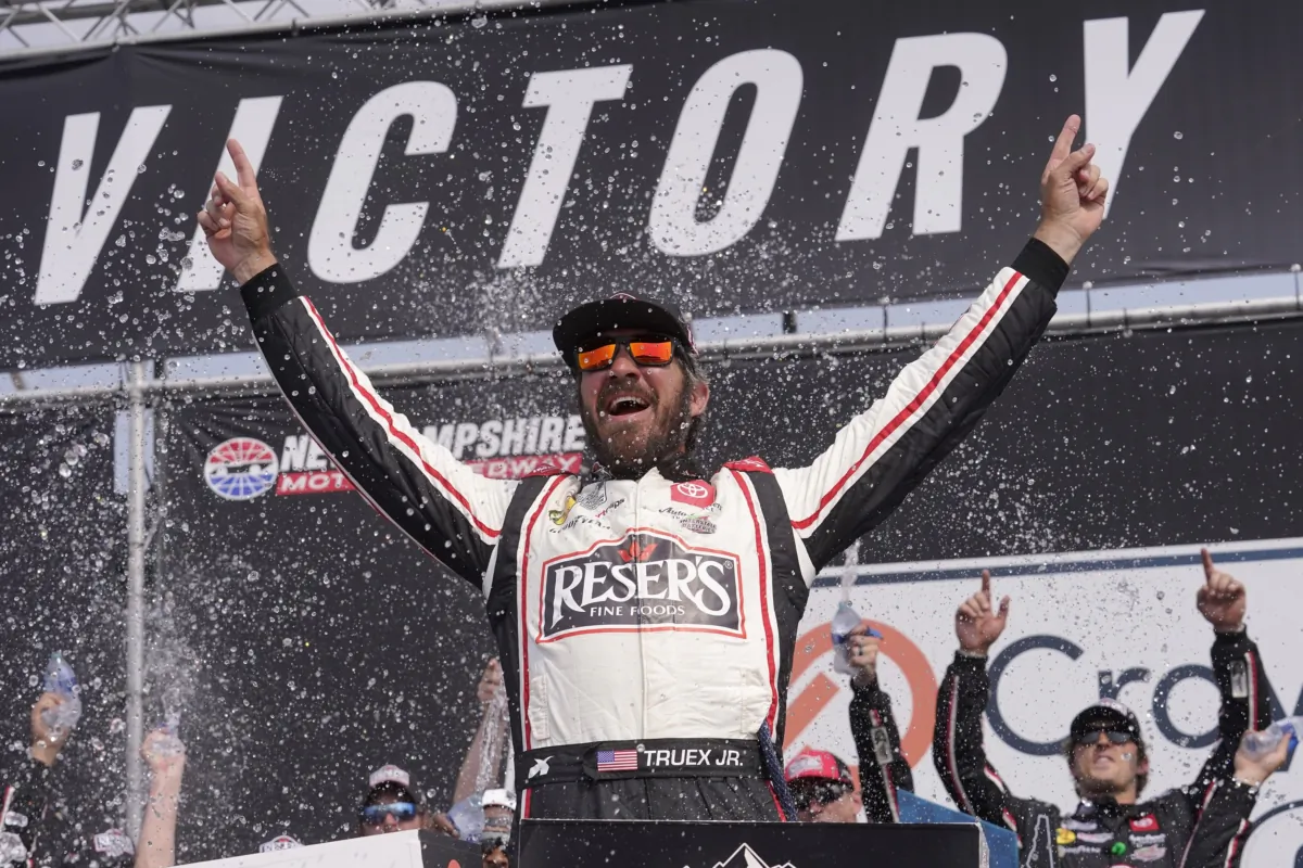 Martin Truex Jr. celebrates his win in the Crayon 301 NASCAR Cup Series auto race at New Hampshire Motor Speedway in Loudon, N.H., on July 17, 2023. (Steven Senne/AP Photo)