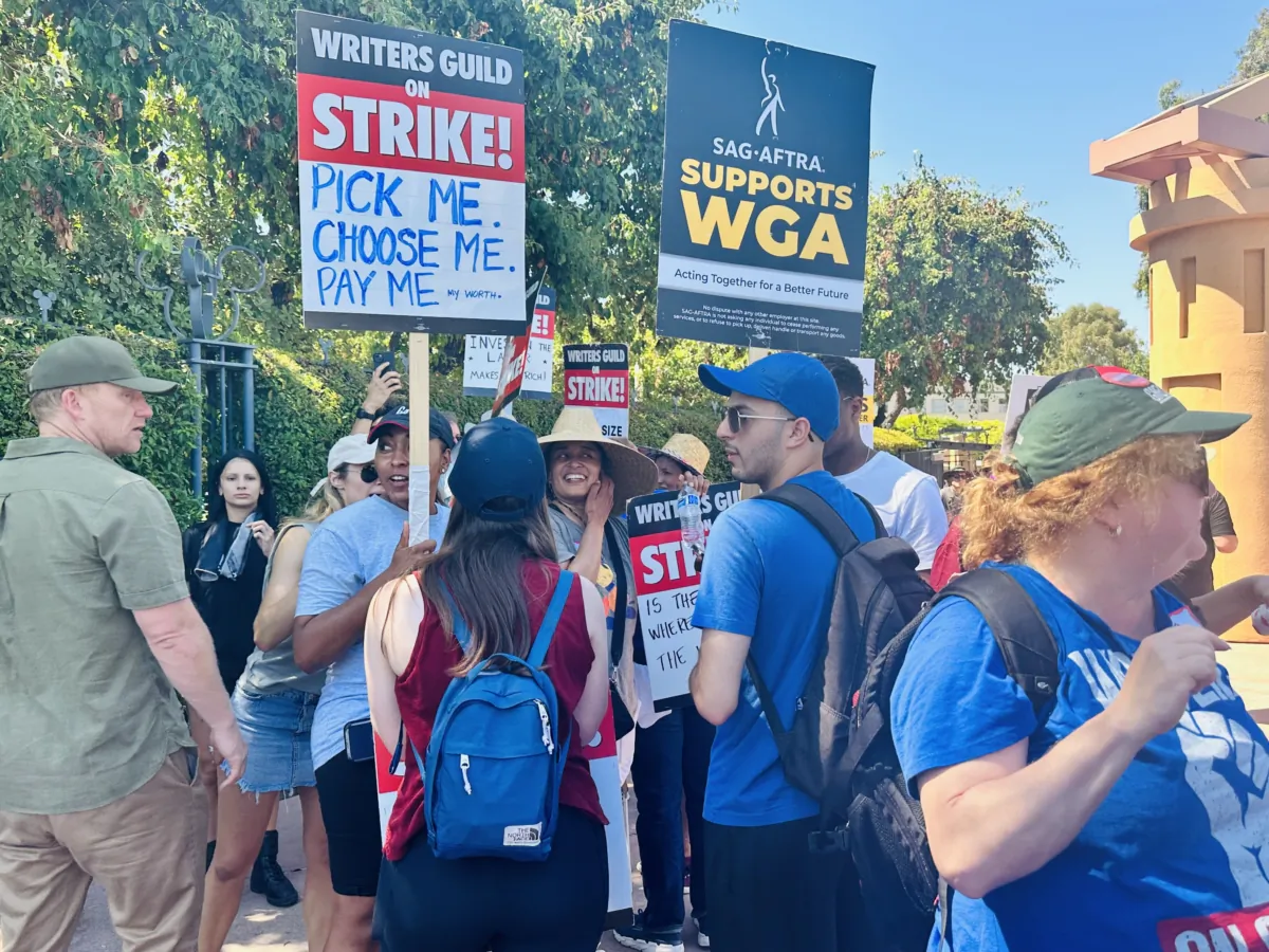 Members of the Writer’s Guild of America and Screen Actors Guild-American Federation of Television and Radio Artists (SAG-AFTRA) picket together outside Disney Studios in Burbank, Calif., on July 18, 2023. (Jill McLaughlin/The Epoch Times)