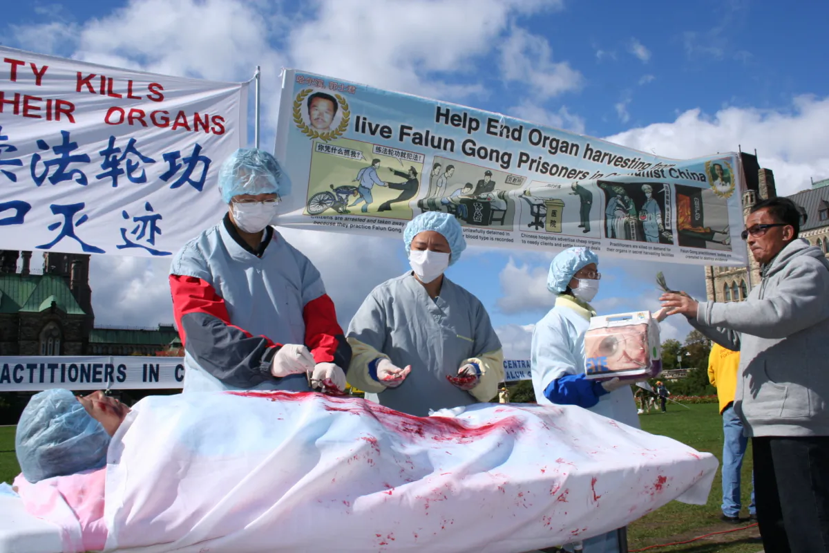 This file photo shows a reenactment of forced organ harvesting in China on Falun Gong adherents during a rally in Ottawa in 2008. (The Epoch Times)