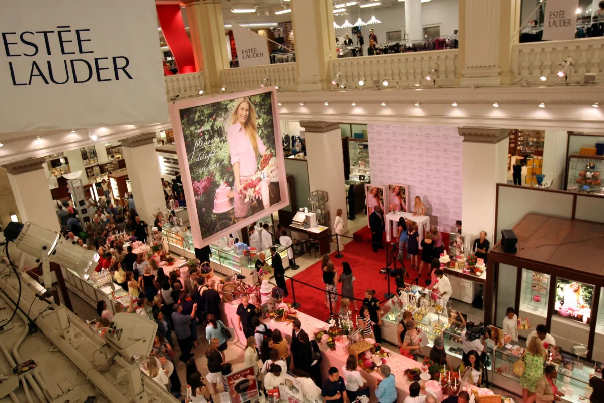 Guests attend Estee Lauder Spokesmodel Gwyneth Paltrow's introduction of the new ''pleasures delight'' fragrance at the Macy's on State Street in Chicago, Illinois, on Aug. 17, 2007. (Tasos Katopodis/Getty Images for Estee Lauder)