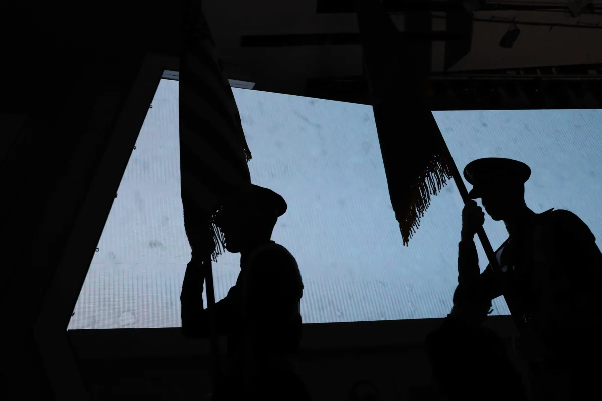 Members of a military honour guard hold the flags of participating nations during a ceremony of U.N. Forces Participation Day event marking the 67th Anniversary of the Korean War armistice agreement, in Seoul, South Korea, on July 27, 2020. (Chung Sung-jun/Getty Images)