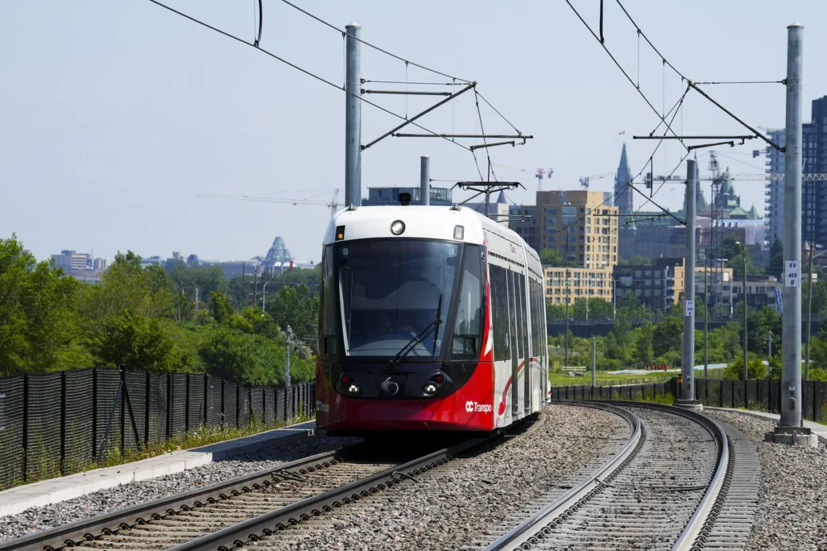 An Ottawa Light Rail Transit (OLRT) train travels along the tracks in Ottawa on June 22, 2022. (The Canadian Press/Sean Kilpatrick)