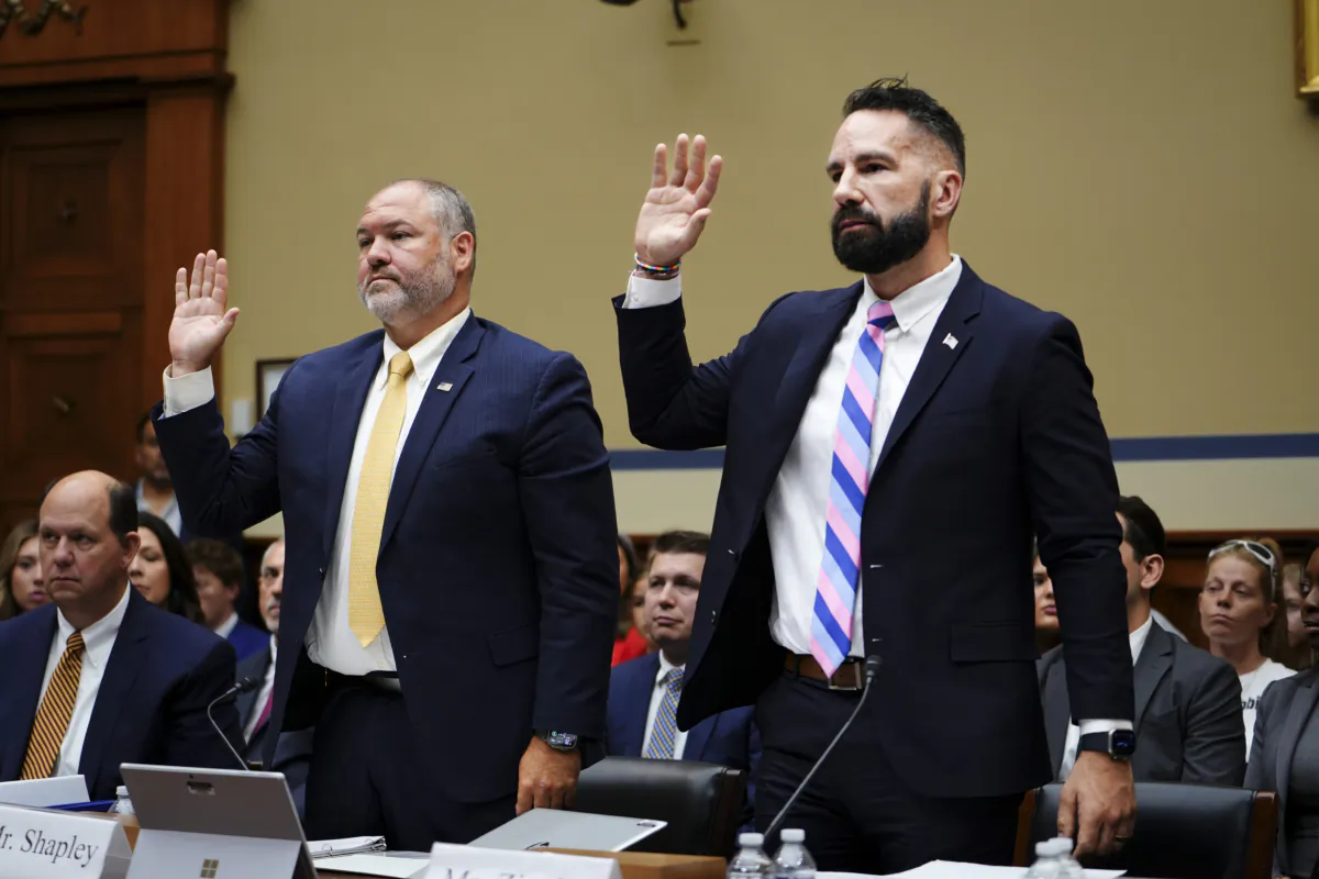 Whistleblowers Gary Shapley (L), IRS Supervisory Special Agent, and Joseph Ziegler (R), IRS Criminal Investigator, swear before the Full Committee on Oversight and Accountability at a hearing about the Biden Criminal Investigation at the U.S. Congress in Washington on July 19, 2023. (Madalina Vasiliu/The Epoch Times)