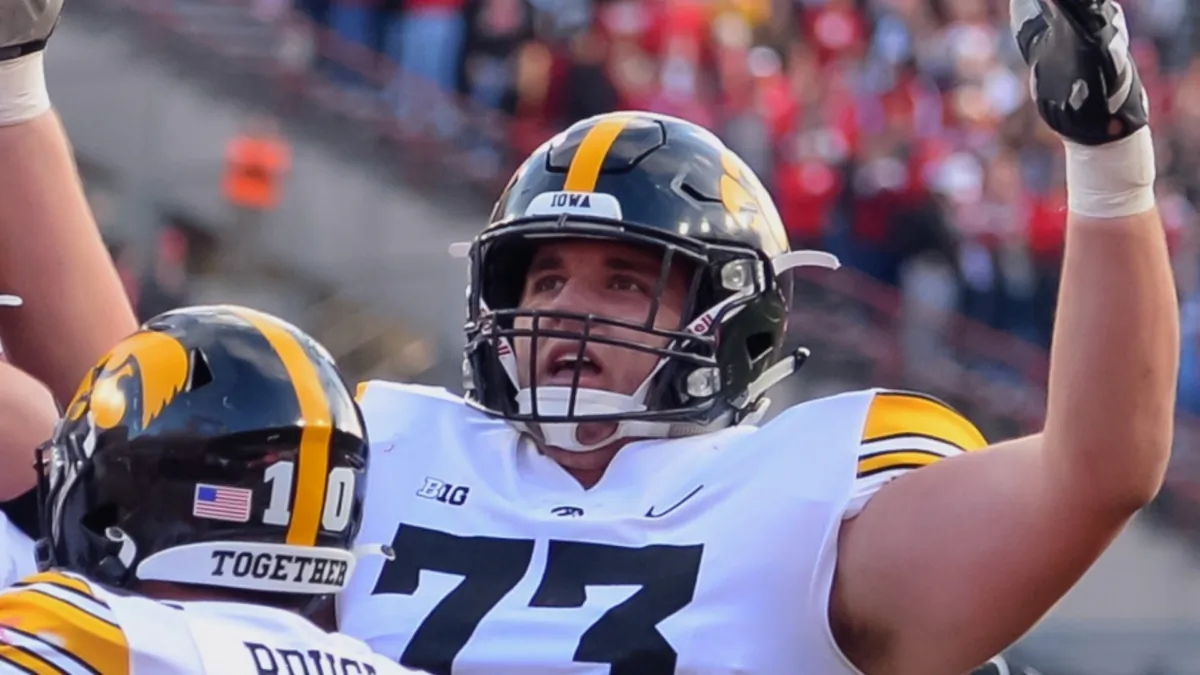 Iowa Hawkeyes offensive lineman Cody Ince #73 celebrates after his team scored the winning touchdown against the Nebraska Cornhuskers in the second half at Memorial Stadium in Lincoln, Nebraska, on Nov. 26, 2021. (Steven Branscombe/Getty Images)