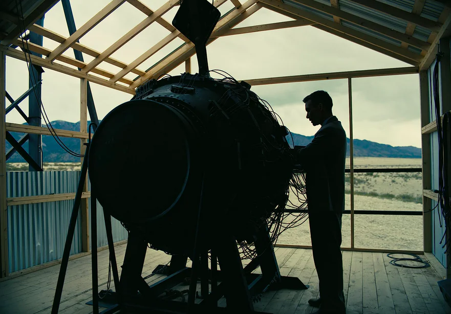 Julius Robert Oppenheimer (Cillian Murphy) inspects a test-run atomic bomb in "Oppenheimer." (Universal Pictures)