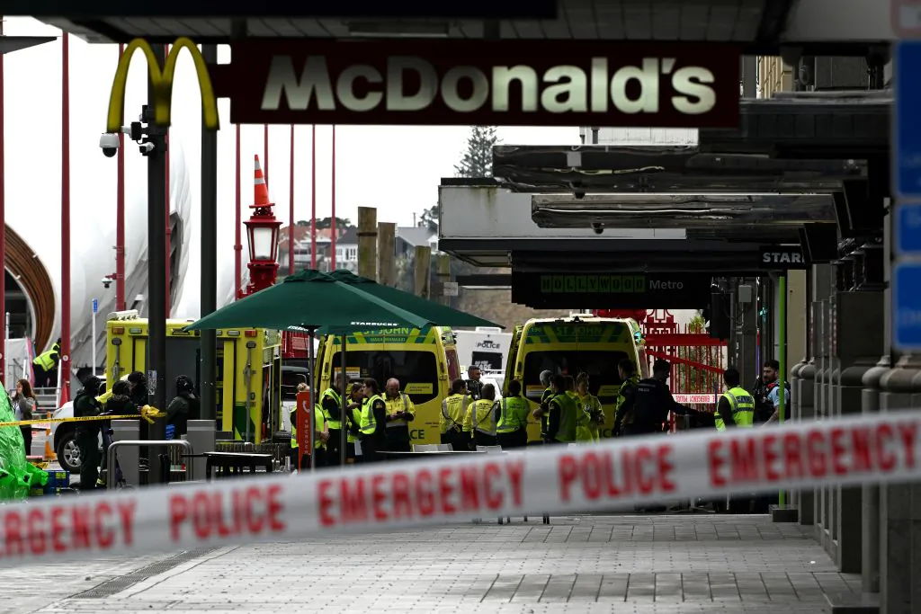 Paramedics stay next to their ambulances at the site of a shooting in central Auckland, New Zealand, on July 20, 2023. (Saeed Khan/AFP via Getty Images)