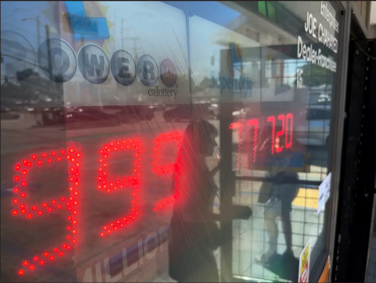 People buy Powerball tickets at Joe's Service Center, a Mobil gas station that previously sold the $2.04 billion-winning Powerball ticket at Woodbury Road and Fair Oaks Avenue in Altadena, Calif., on July 19, 2023. (Damian Dovarganes/AP Photo)