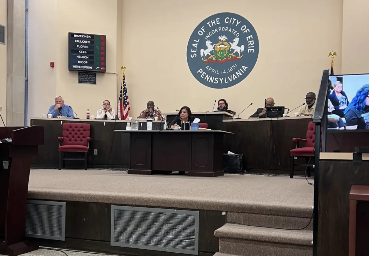City council members Ed Brzezinski (L), Jasmine Flores (2L), Michael Keyes(3L), Chuck Nelson (3R), Mel Witherspoon (2R) and Maurice “Mo” Troop (R) debate whether to adopt a resolution that would declare their intention to create a "sanctuary city" for LGBT individuals in Erie, Pa., on July 19, 2023. (Courtesy of Dr. Tony Ruffa)