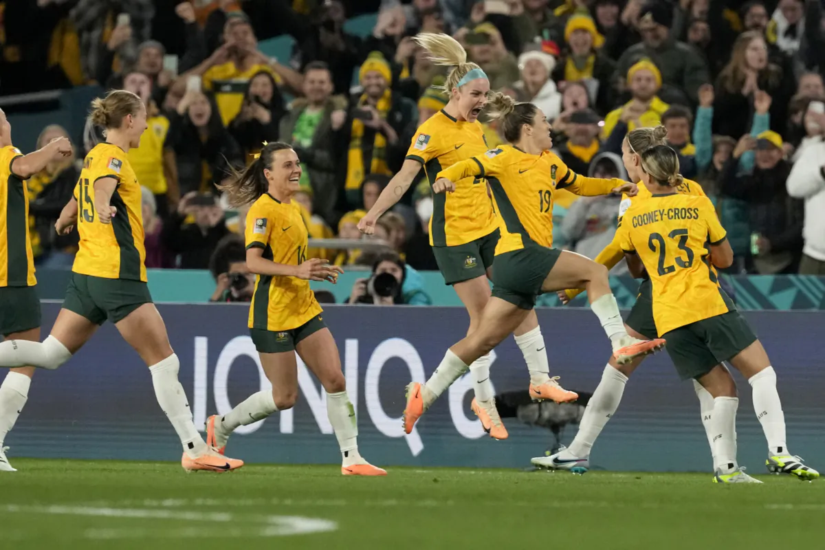 Australia players celebrate after Steph Catley scored the opening goal from the penalty spot during the Women's World Cup soccer match between Australia and Ireland at Stadium Australia in Sydney, Australia on July 20, 2023. (Mark Baker/AP Photo)
