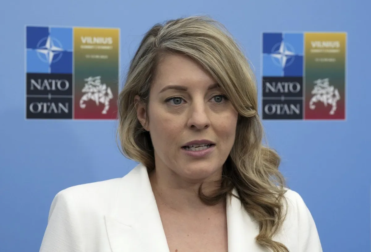 Foreign Affairs Minister Melanie Joly speaks with reporters at the NATO Summit in Vilnius, Lithuania on July 11, 2023. (The Canadian Press/Adrian Wyld)
