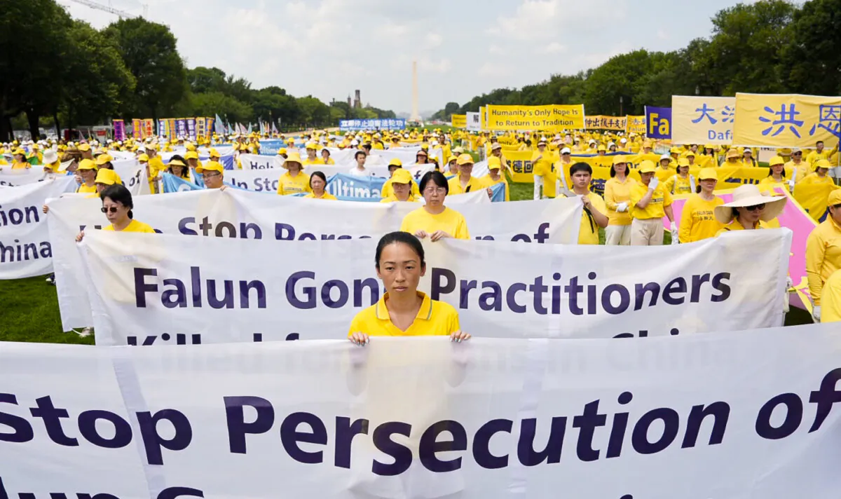 Falun Gong practitioners call for an end to the persecution of the spiritual group in China, during an event marking 24 years since the launch of the persecution, on Capitol Hill on July 20, 2023. (Samira Bouaou/The Epoch Times)