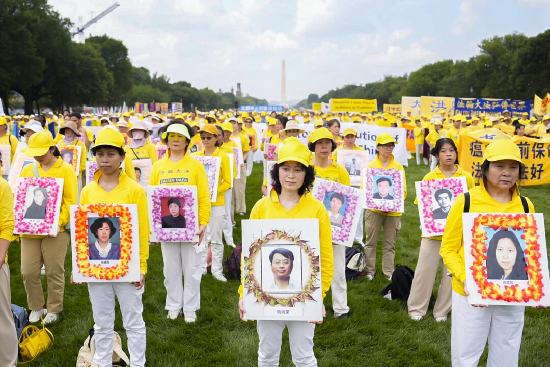 Falun Gong practitioners call for an end to the persecution of the spiritual group in China, during an event marking 24 years since the launch of the persecution, on Capitol Hill on July 20, 2023. (Samira Bouaou/The Epoch Times)