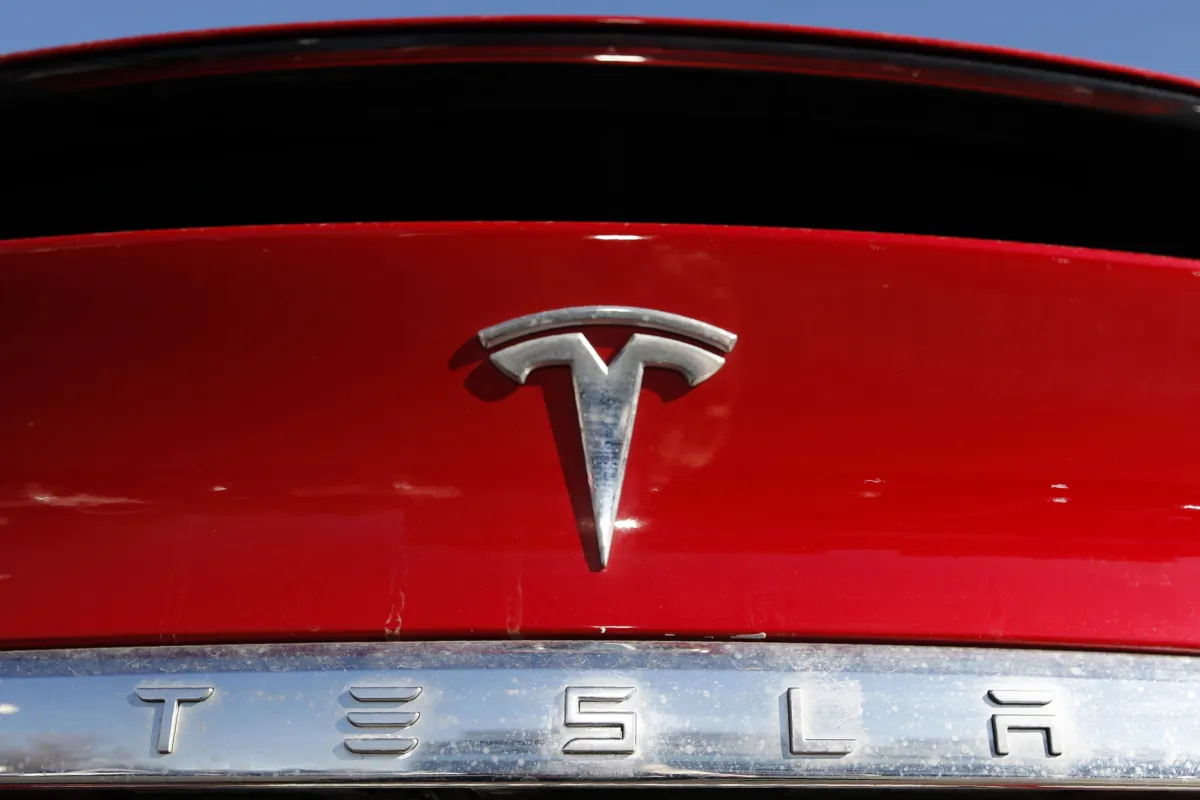 The Tesla company logo is shown at a Tesla dealership in Littleton, Colo., on Feb. 2, 2020. (David Zalubowski/AP Photo)
