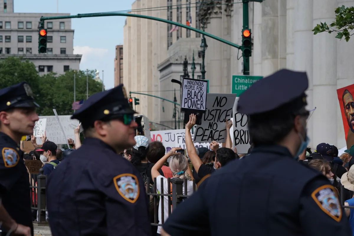 New York City Police look on as protesters march into Manhattan from the Brooklyn Bridge over the death of George Floyd by Minneapolis Police in New York on June 19, 2020. (Bryan R. Smith/AFP via Getty Images)