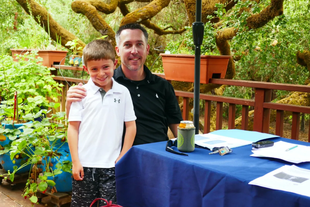 H.N. and his father, Justin Nordgreen, in their backyard in Scotts Valley, Calif., on July 16, 2023. (Steve Ispas/The Epoch Times)