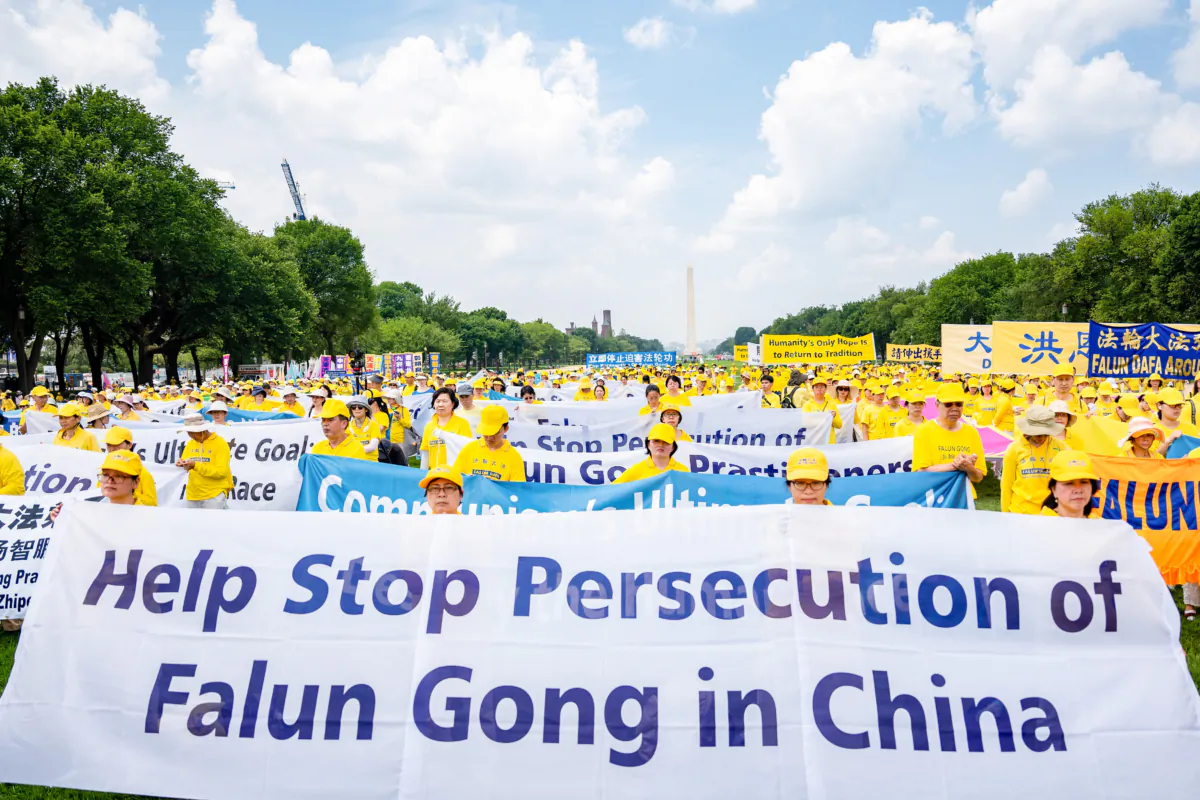 Falun Gong practitioners call for an end to the persecution of the spiritual group in China during an event to mark the 24 years since the launch of the persecution by the Chinese Communist Party, on Capitol Hill in Washington, on July 20, 2023. (Samira Bouaou/The Epoch Times)