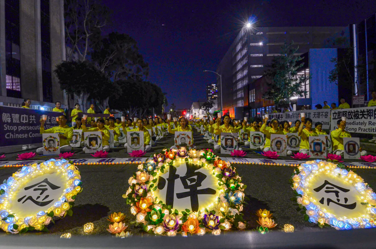 Falun Gong adherents hold a candlelight vigil in front of the Chinese Consulate to mark 24 years of persecution by the Chinese Communist Party in Los Angeles on July 18, 2023. (Alex Lee/The Epoch Times)