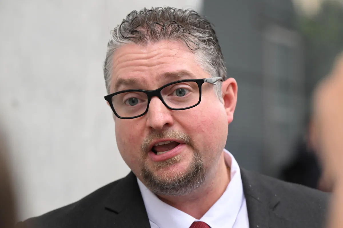 Dr William Bay is seen talking to supporters outside the Brisbane Supreme Court in Brisbane, Australia, on Nov. 30, 2022. (AAP Image/Darren England)