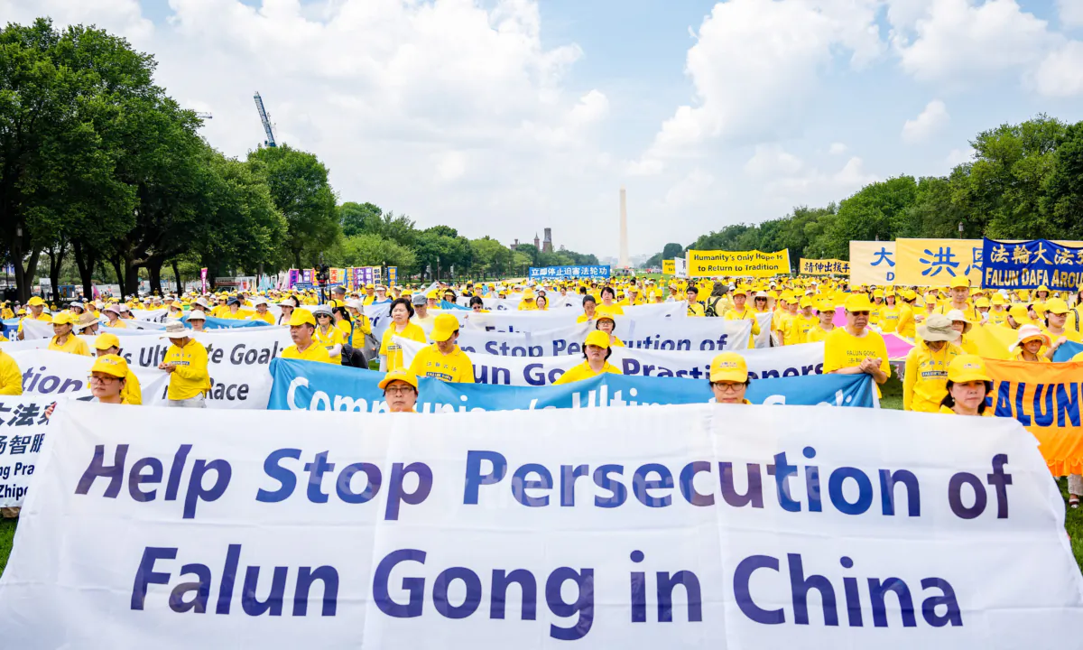 Falun Gong believers call for an end to the persecution of the spiritual group in China, during an event marking 24 years since the launch of the persecution, on Capitol Hill on July 20, 2023. (Samira Bouaou/The Epoch Times)