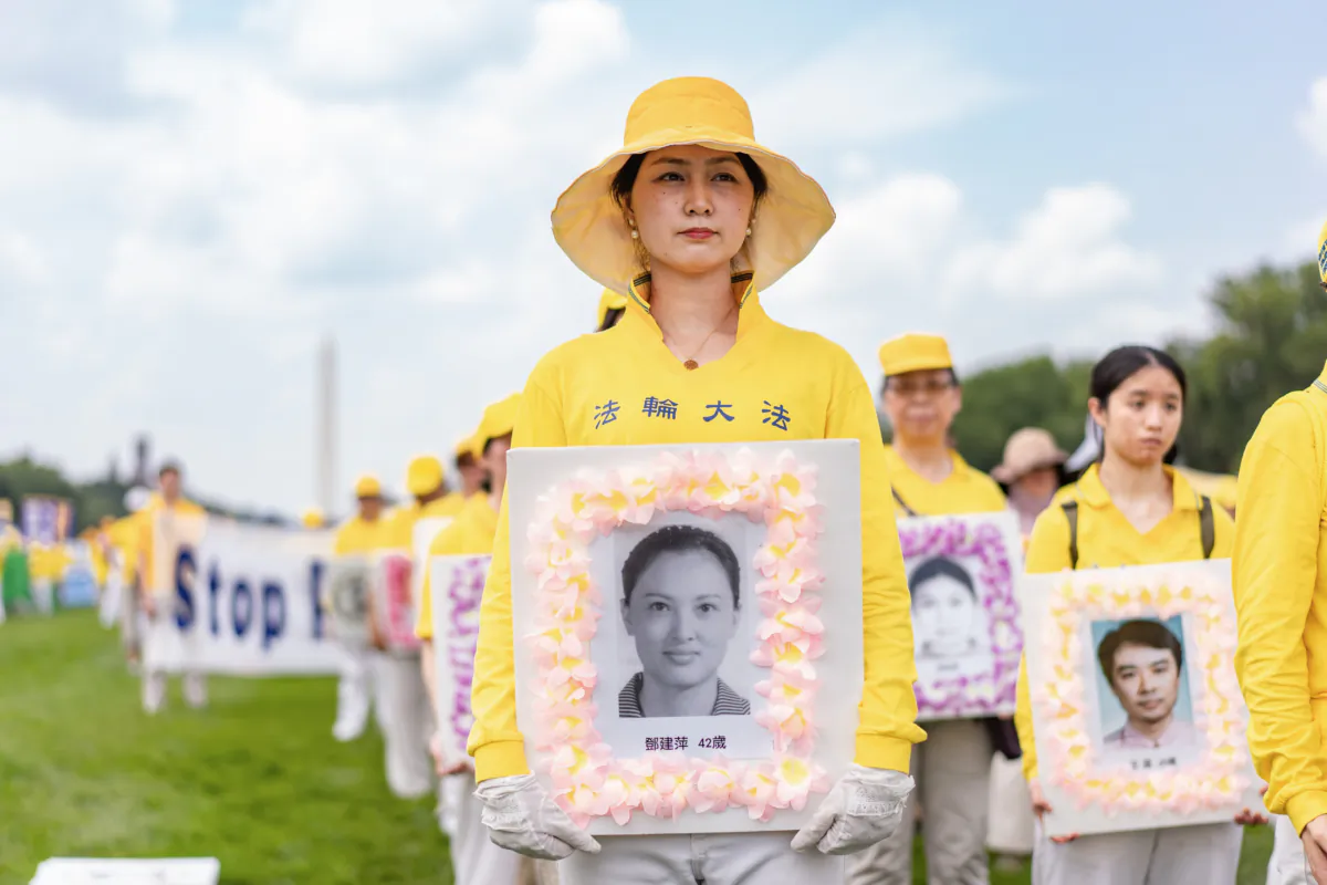 Falun Gong take part in a rally to mark the 24th anniversary of the persecution of the spiritual discipline in China at the National Mall in Washington on July 20, 2023. (Samira Bouaou/The Epoch Times)