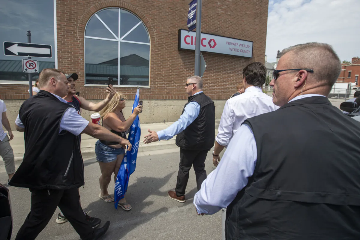 Protesters shout at Prime Minister Justin Trudeau in Belleville, Ontario, on July 20, 2023. (The Canadian Press/Lars Hagberg)