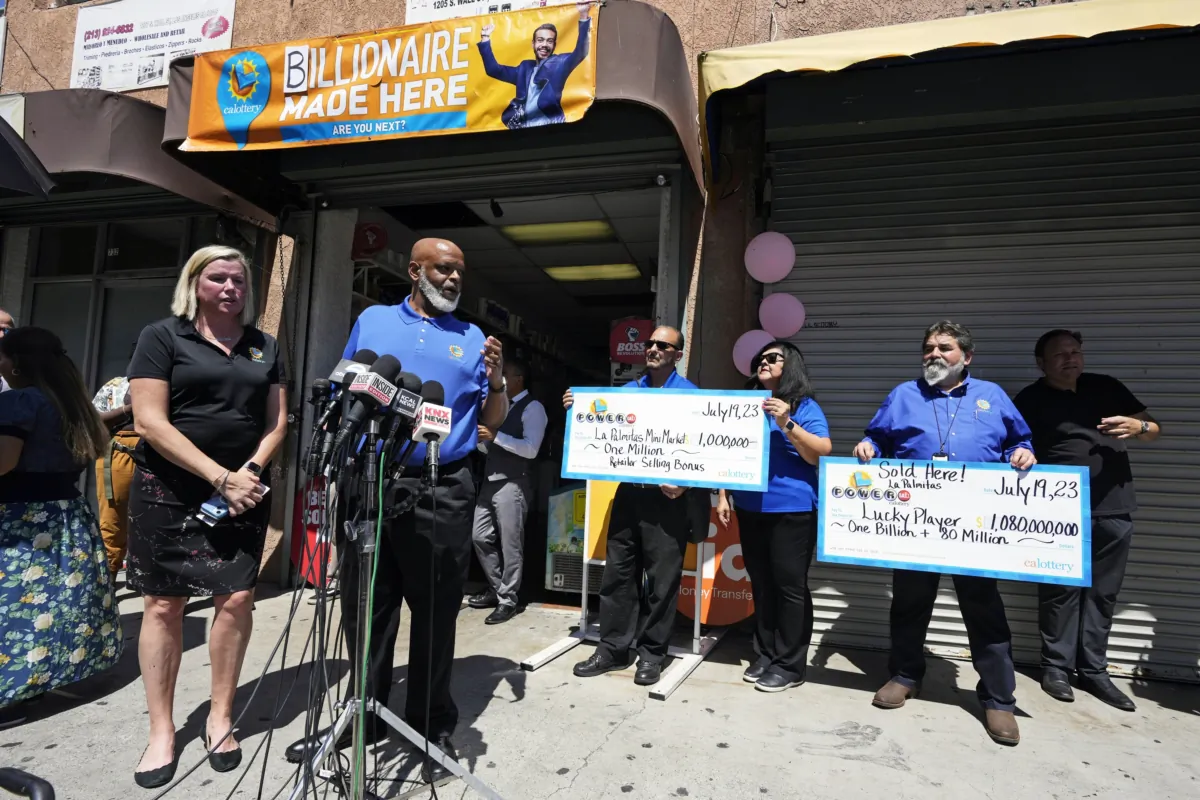 California State Lottery spokesperson Carolyn Becker (L) and director Alva Johnson speak during a news conference outside the Las Palmitas Mini Market in downtown Los Angeles on July 20, 2023, where the winning ticket for the Powerball jackpot, worth an estimated $1.08 billion, was sold. (Marcio Jose Sanchez/AP Photo)