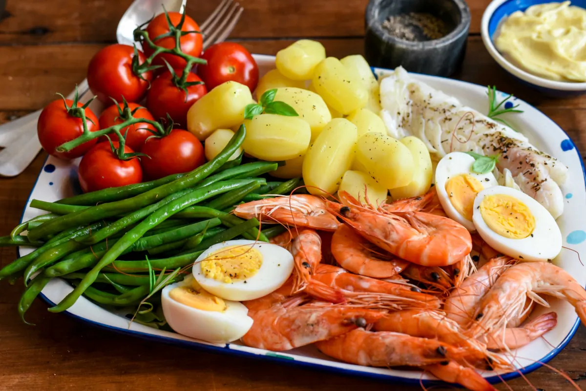 A grand aïoli is the namesake sauce served with an array of dippable accompaniments—including seasonal vegetables, seafood, and sometimes even hard-boiled eggs. (Audrey Le Goff)