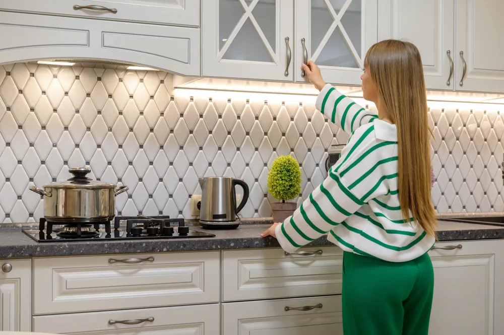 Cabinet doors go out of alignment eventually, but can be easily screwed back into place for many more years of smooth opening.(Serghei Starus/Shutterstock)