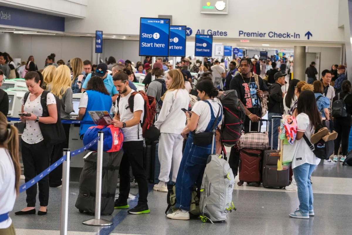 Travelers wait in line to check-in at the Los Angeles International Airport in Los Angeles, Wednesday, June 28, 2023. (Ringo Chiu/Shutterstock)
