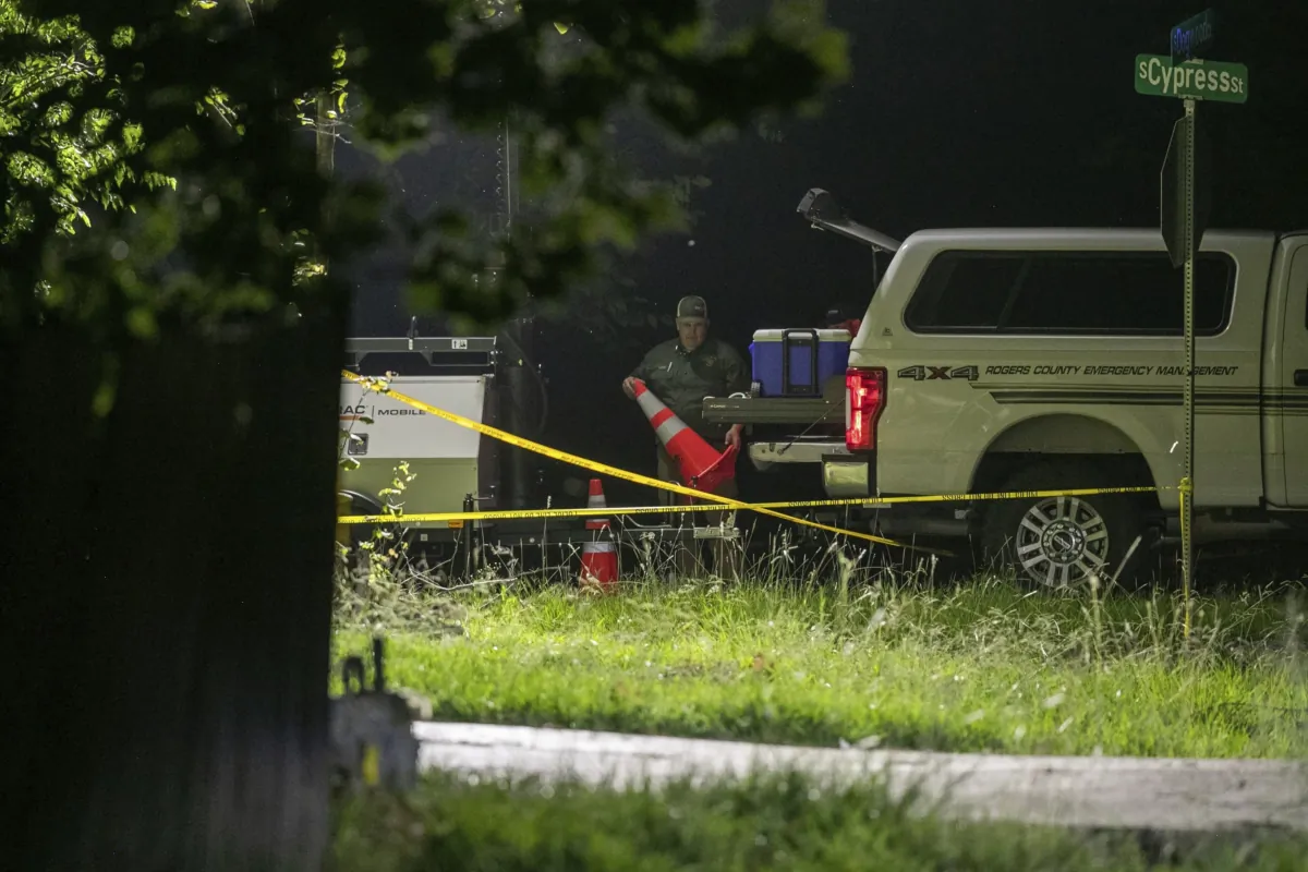 Members of several law enforcement agencies investigate the scene were several people were reportedly killed after a hostage situation in Verdigris, Okla., on July 20, 2023. (Daniel Shular/Tulsa World via AP)