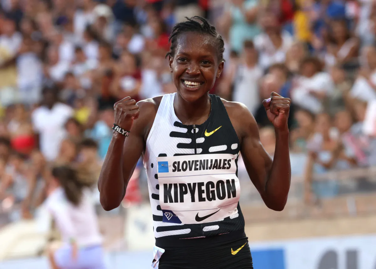 Kenya's Faith Kipyegon celebrates after winning the women's 1 mile final during Diamond League at Stade Louis II in Monaco on July 21, 2023. (Claudia Greco/Reuters)