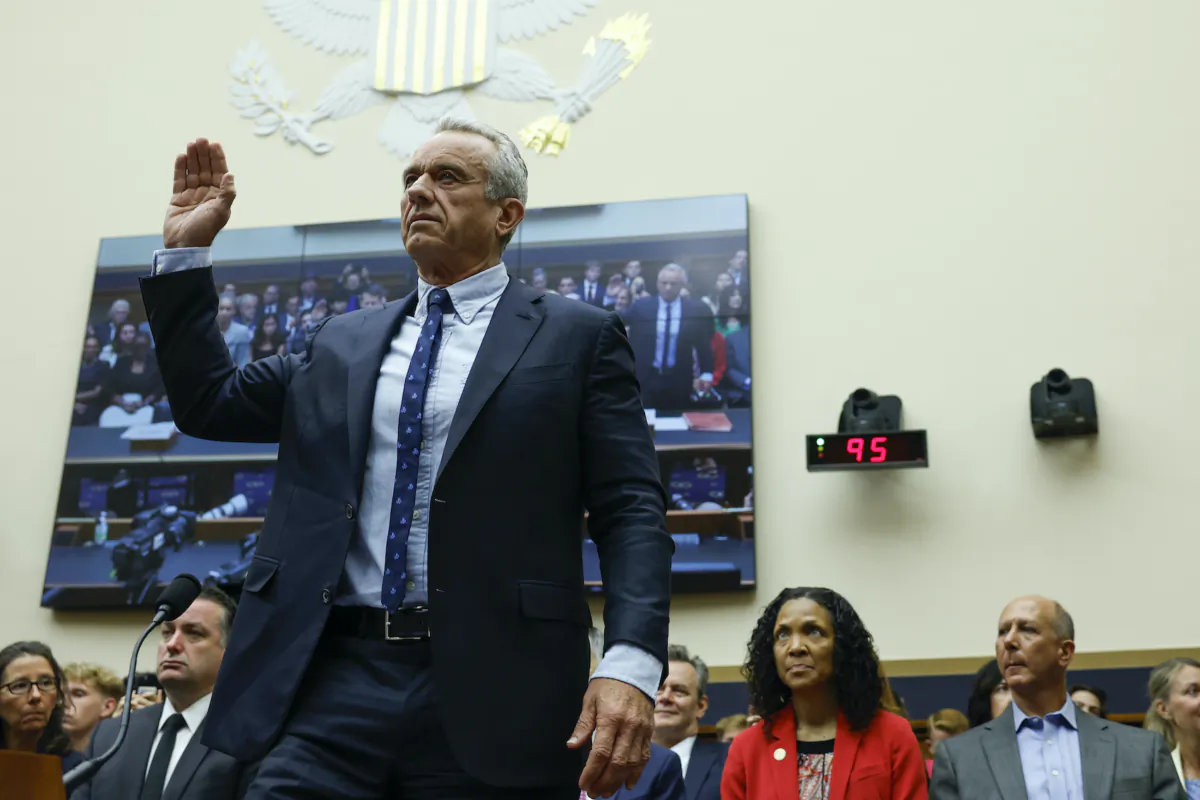 Democratic presidential candidate Robert F. Kennedy Jr. holds his right hand up as he is sworn in for a hearing with the House Judiciary Subcommittee on the Weaponization of the Federal Government on Capitol Hill in Washington on July 20, 2023. (Anna Moneymaker/Getty Images)