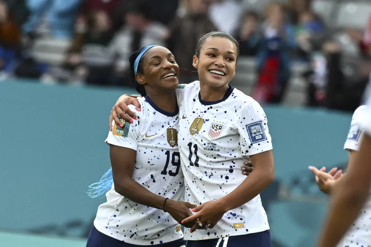 United States' Sophia Smith, right, celebrates with United States' Crystal Dunn after scoring her side's 2nd goal during the Women's World Cup Group E soccer match between the United States and Vietnam at Eden Park in Auckland, New Zealand on July 22, 2023. (Andrew Cornaga/AP Photo)